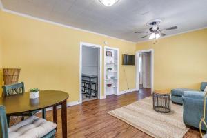 a living room with a table and a couch at Granbury Sunshine Shack - 2 Bedroom in Granbury