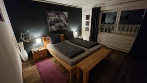a living room with a couch and a table at Urlaub am Sonnenhügl in Rinchnach
