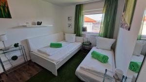 a living room with two beds and a window at Urlaub am Sonnenhügl in Rinchnach