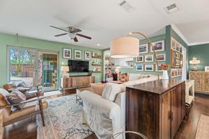 a living room with a couch and a table at Lake Highlands Retreat in Dallas
