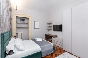 Letto o letti in una camera di 5 minutes from Via Roma - with Smart TV