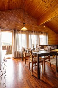 a dining room with a table and chairs at Nice Sirdal Bungalow in Ådneram in Ådneram