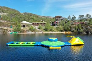 two inflatable water slides in the middle of a lake at Nice Sirdal Bungalow in Ådneram in Ådneram