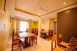 a dining room with a table and chairs at Hotel Horizon Hues in Port Blair