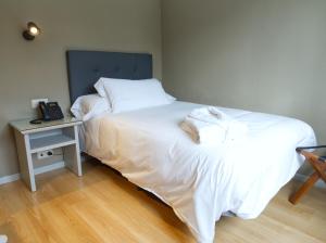 Cama o camas de una habitación en Hotel Ciudad del Sol