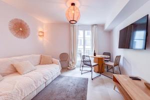 TV a/nebo společenská místnost v ubytování Spacieux Appartement - K3