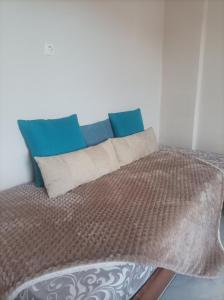 A bed or beds in a room at Eirini's Apartment