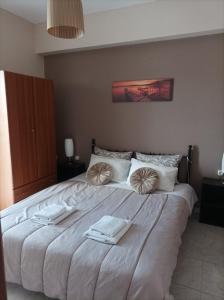 A bed or beds in a room at Eirini's Apartment