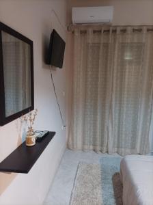 A television and/or entertainment centre at Eirini's Apartment