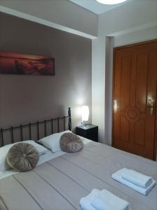 A bed or beds in a room at Eirini's Apartment