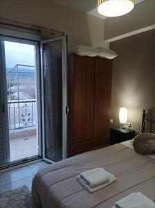 A bed or beds in a room at Eirini's Apartment