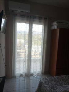 A bed or beds in a room at Eirini's Apartment