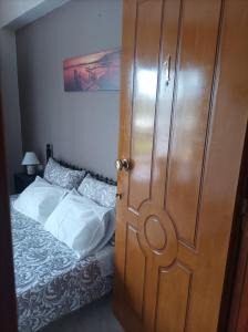 A bed or beds in a room at Eirini's Apartment