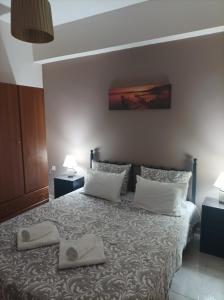 A bed or beds in a room at Eirini's Apartment