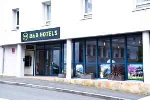 a building with a sign that reads bbc hotels at B&B HOTEL Rodez Bourran in Rodez