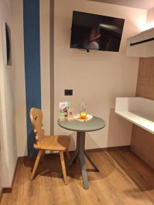 TV a/nebo společenská místnost v ubytování Hotel Dolomiti Saone