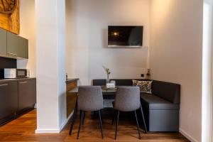 a living room with a table and two chairs at Appartement Hoamatgfüh in Saalbach-Hinterglemm