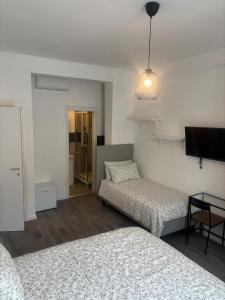 Postel nebo postele na pokoji v ubytování PORTA FURBA Suites