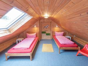 a room with two beds in a attic at Ferienhof Pulte in Attendorn