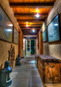 a hallway in a house with a wooden ceiling at Cotommatae Hydra 1810 in Hydra