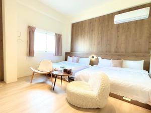 Een bed of bedden in een kamer bij 沙沙民宿
