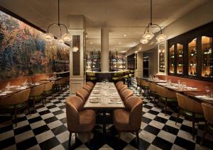 a dining room with a long table and chairs at Sixty DC in Washington, D.C.
