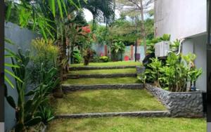 a garden with steps leading up to a building at Beautiful house in Boracay Aklan in Boracay