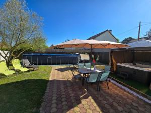 Zahrada ubytování Appartement T2 confortable - Piscine et Jacuzzi