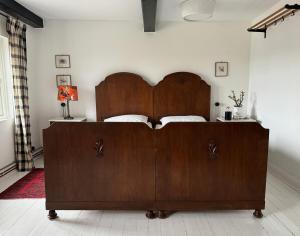 a bedroom with a large wooden bed in a room at Panorama-Loft Fehmarn mit Meerblick in Fehmarn