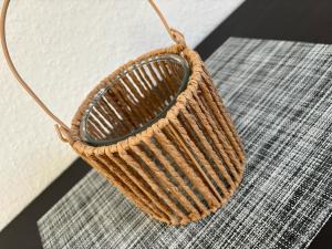 a basket sitting on top of a rug at Modernes Apartment Dornberg in Bielefeld