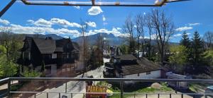 a view from the balcony of a house at Willa JANUS in Zakopane