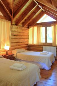 Postel nebo postele na pokoji v ubytování Cabañas Ruca Kuyen Golf & Resort