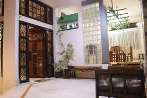 a view of the front door of a house at The LYNMAR HOMESTAY at Mawkynroh in Shillong