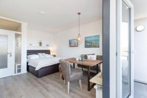 Postel nebo postele na pokoji v ubytování Haus Seebad Ostseeperle Grömitz