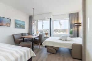 Postel nebo postele na pokoji v ubytování Haus Seebad Ostseeperle Grömitz