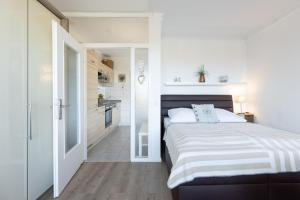 Postel nebo postele na pokoji v ubytování Haus Seebad Ostseeperle Grömitz