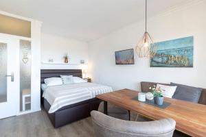 Postel nebo postele na pokoji v ubytování Haus Seebad Ostseeperle Grömitz