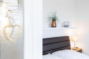 Postel nebo postele na pokoji v ubytování Haus Seebad Ostseeperle Grömitz