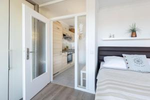 Postel nebo postele na pokoji v ubytování Haus Seebad Ostseeperle Grömitz
