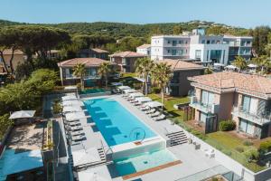 an aerial view of a house with a swimming pool at Kube Saint-Tropez in Saint-Tropez