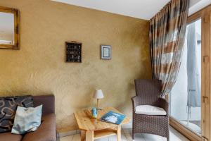 a living room with a couch and a table at Ferienwohnung Würtenberger 68 qm in Öhningen