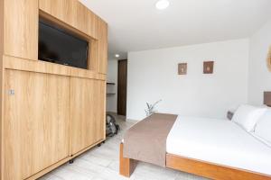 Postel nebo postele na pokoji v ubytování Hotel Prada