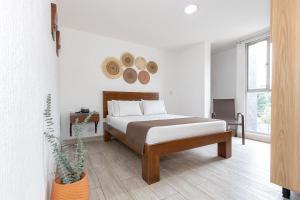 Postel nebo postele na pokoji v ubytování Hotel Prada
