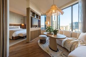 a hotel room with a couch and a bed at 1 Hotel Seattle in Seattle +58 photos