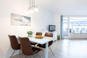 TV a/nebo společenská místnost v ubytování Grömitz Center Nordische Sonne