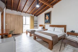 Postel nebo postele na pokoji v ubytování Hotel Prada