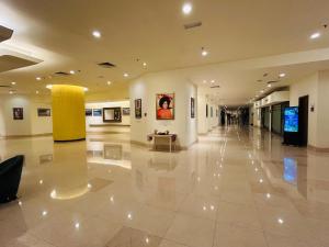 a large lobby with a large white tile floor at KSM GLOBAL APARTMENT At TIMES SQUARE kl in Kuala Lumpur +165 photos