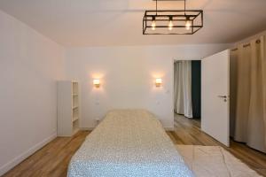 En eller flere senge i et værelse på Centre Pornichet - 7 min à pied plage