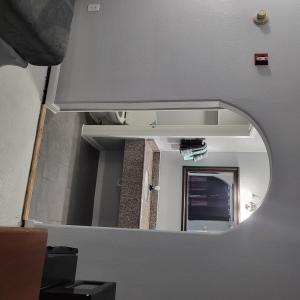a mirror on a wall in a room at 2 Full Bed Private Room 130 in Livingston