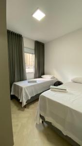 Postel nebo postele na pokoji v ubytování Apartamento Premium - Próximo do Minas Centro e Mercado Central BH